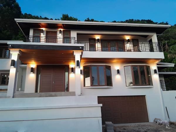Smart villa with dusk exterior lighting in Jacks Hill, Kingston